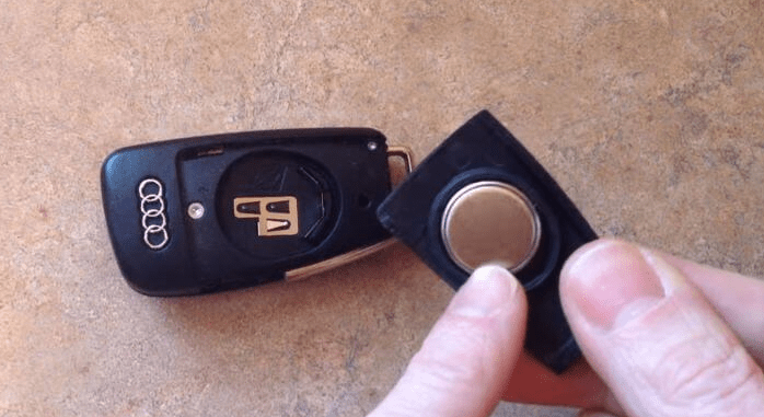 The battery is installed in the key fob cover